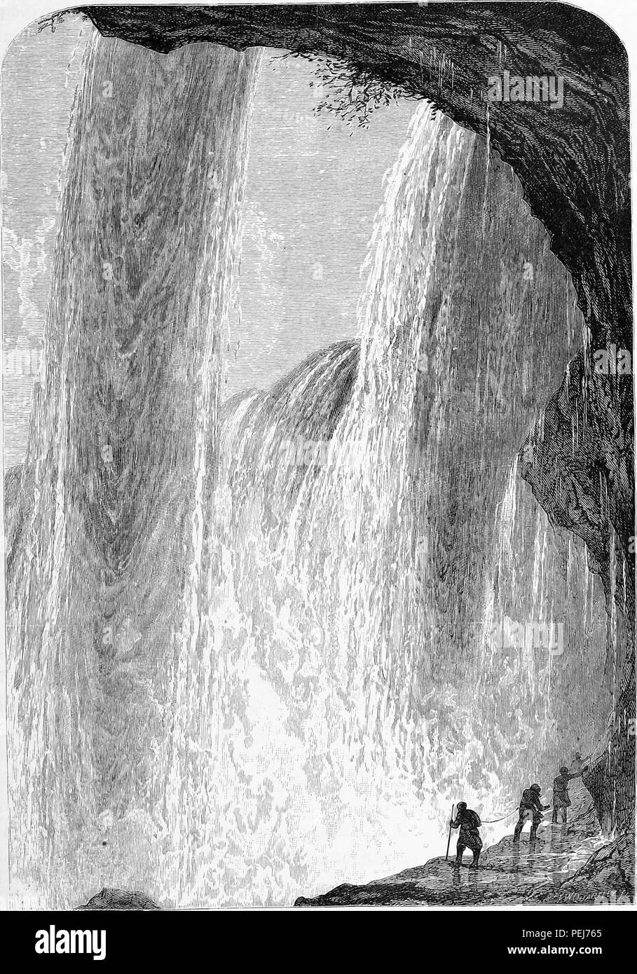 Black and white vintage print depicting several people, tied together with rope at their waists, hiking up a rock ledge underneath the falls on the Canadian side of the Niagara Waterfalls, published in William Cullen Bryant's edited volume 'Picturesque America; or, The Land We Live In', 1872. Courtesy Internet Archive. () Stock Photo