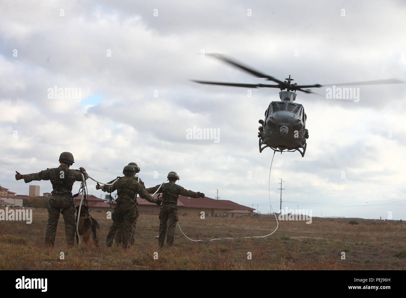 U.S. Marines with Marine Corps Forces Special Operations Command (MARSOC)  prepare to be air lifted during special patrol insertion and extraction  rigging exercise aboard Camp Pendleton, Calif., Nov. 24, 2015. Marines with
