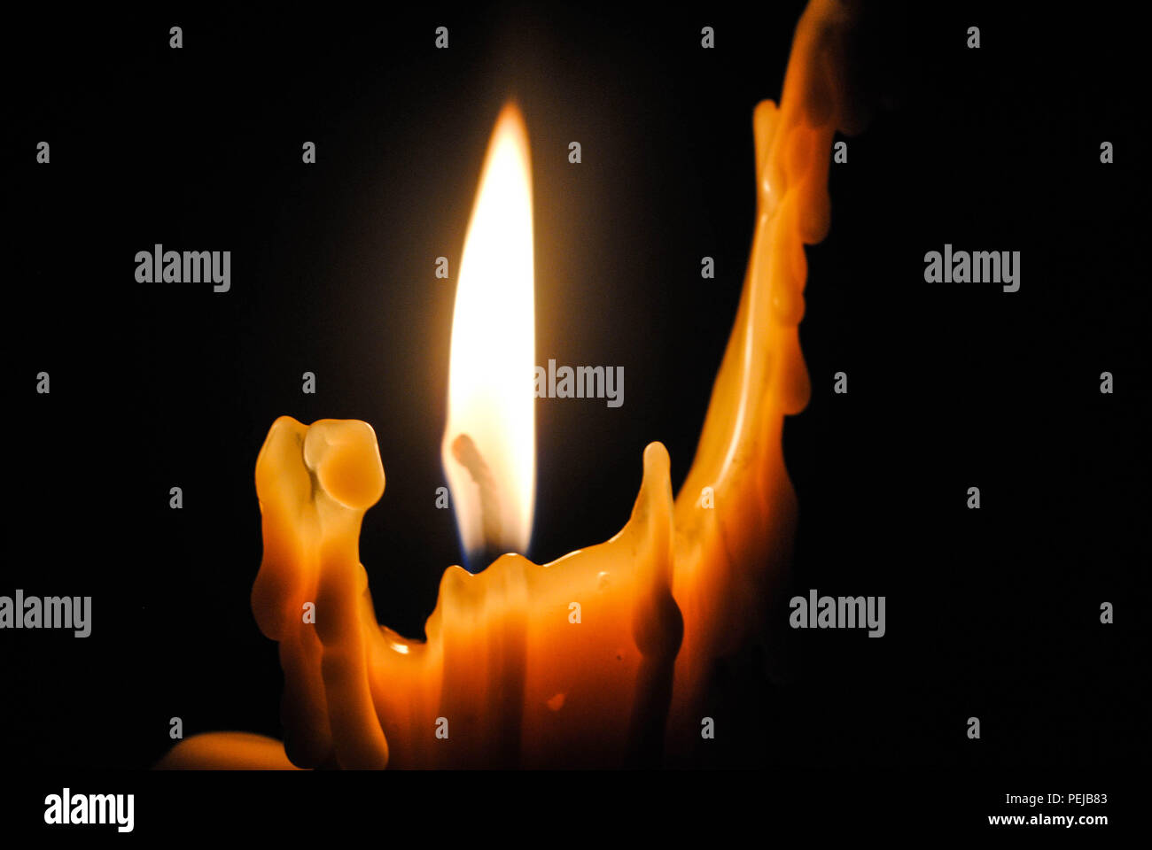 Candle that looks like it has human shape and pose Stock Photo Alamy