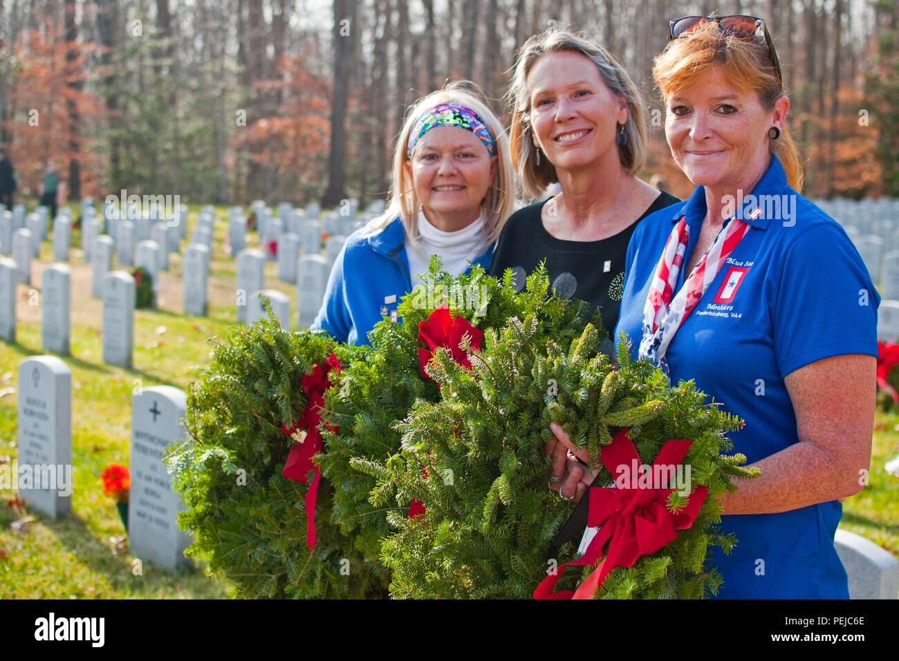 Teri Reece, Blue Star Mothers president, Rhonda Kuebler, Blue Star Mother member, and Sharon Kendall, Blue Star Mother member, participated in the annual Wreaths Across America Dec. 12 at Quantico National Cemetery in Triangle, Va. After seven years, the group continues to support veterans and their families at this annual wreathes across America. In addition to the wreaths, the mothers raise funds to send approximately 400 care packages to deployed troops overseas during the holidays. Stock Photo