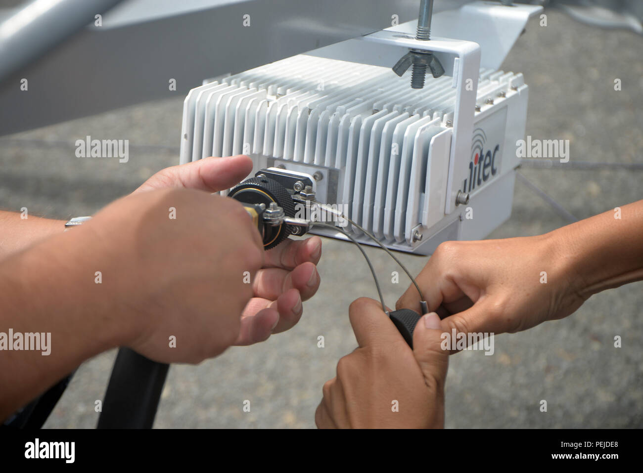 A satellite dish is disassembles on the Mobile Sealift Operations ...