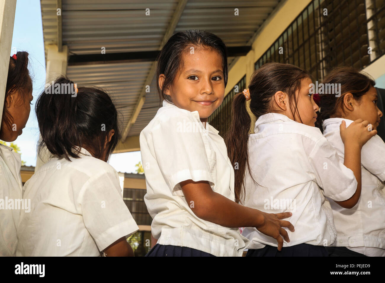 Students from Jairo Ayala School in Trujillo, Honduras, wait in line to receive a dental hygiene class on Aug. 31, 2015.  Members of the U.S. Navy donated shoes to the students and taught dental and general hygiene classes in support of Operation Continuing Promise. Operation Continuing Promise is a mission in which the United States military works with host nations to provide humanitarian assistance and execute civil-military operations alongside various partner nations within the Caribbean and Central and South America. (U.S. Marine Corps photo by Cpl. Kirstin Merrimarahajara/released) Stock Photo