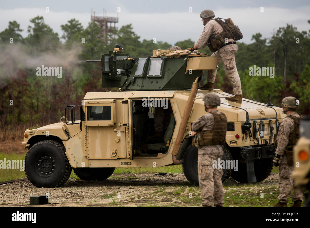 A Marine With 2nd Air Naval Gunfire Liaison Company Shoots An M2 50 Caliber Heavy Machine Gun From The Turret Position Of A Humvee During A Week Long Field Exercise At Camp Lejeune
