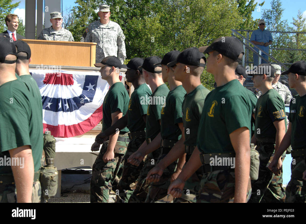 Michigan Youth Challenge Academy cadre and cadets march in the annual pass in review of the troops ceremony at Camp Grayling Joint Maneuver Training Center, Grayling, Mich., Aug. 21, 2015. Michigan Lt. Gov. Brian Calley was the keynote speaker and reiterated his thanks to the Soldiers and their families. (U.S. Air National Guard photo by Master Sgt. Denice Rankin/Released) Stock Photo
