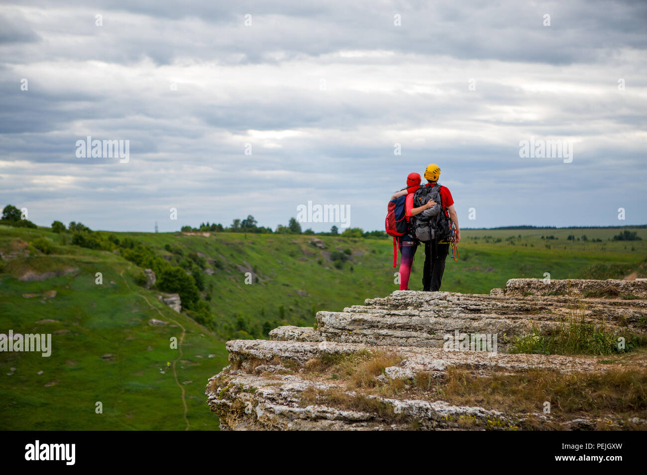 Photo from back of hugging man and woman tourist on mountain Stock ...