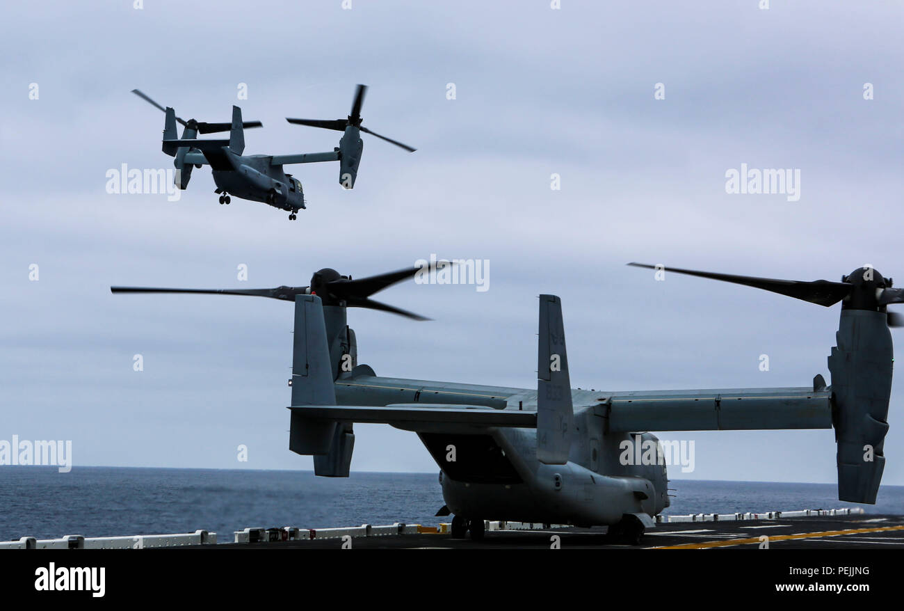 MV-22 Ospreys practice flight operations aboard the amphibious assault ship USS Boxer (LHD 4) during Exercise Dawn Blitz 2015, Aug. 31, 2015. Dawn Blitz is a multinational amphibious training exercise designed to train Expeditionary Strike Group Three, 1st Marine Expeditionary Brigade and Coalition partners in the operations expected of an amphibious task force while also building U.S. and Coalition operational interoperability from the sea. (U.S. Marine Corps photo by Lance Cpl. April L. Price/Released) Stock Photo