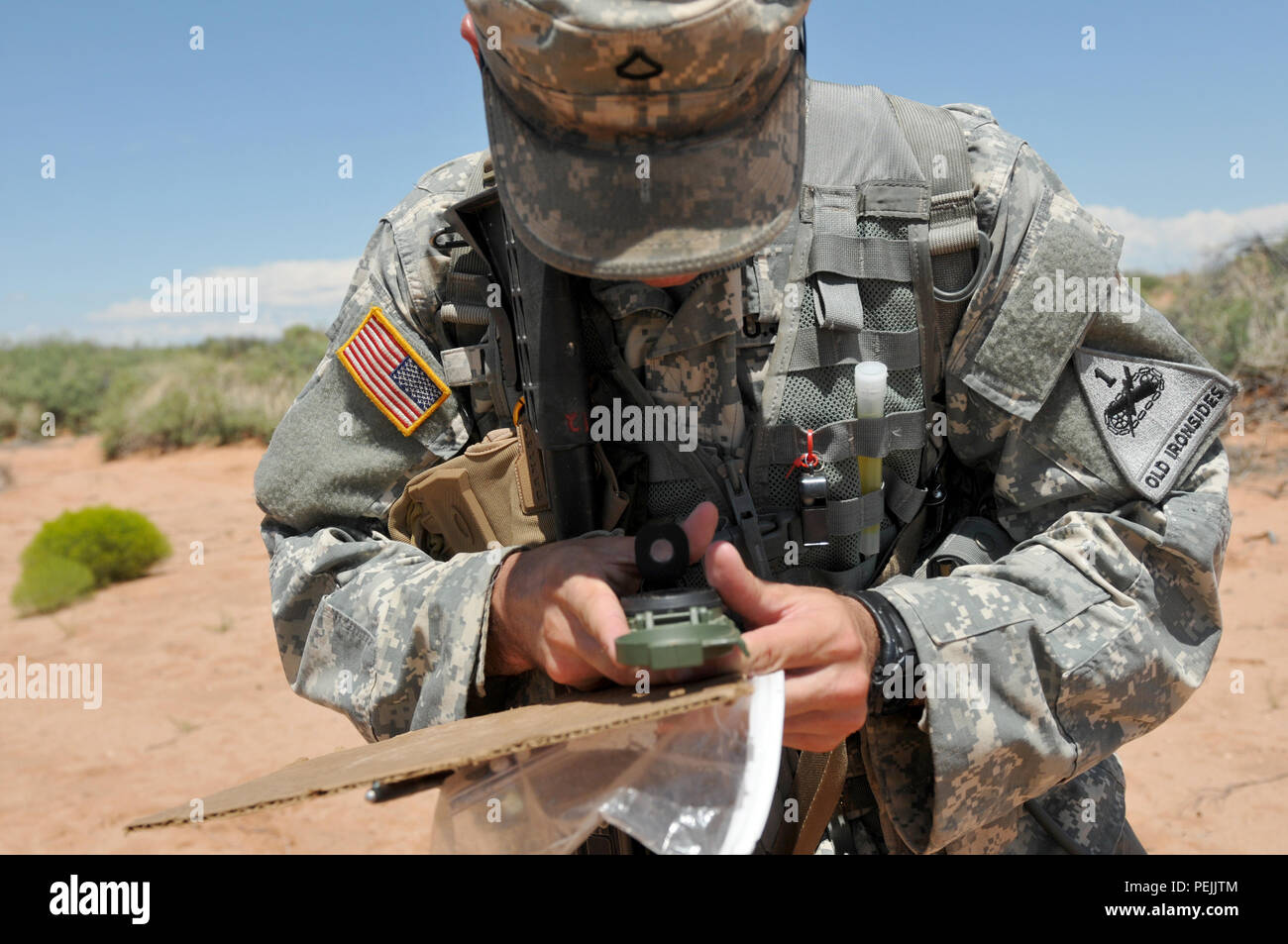 A soldier from 1st Battalion, 6th Infantry Regiment, 2nd Armored Brigade  Combat Team, 1st Armored Division navigates the land navigation course  during Expert Infantry Badge testing at Fort Bliss, Texas, on August