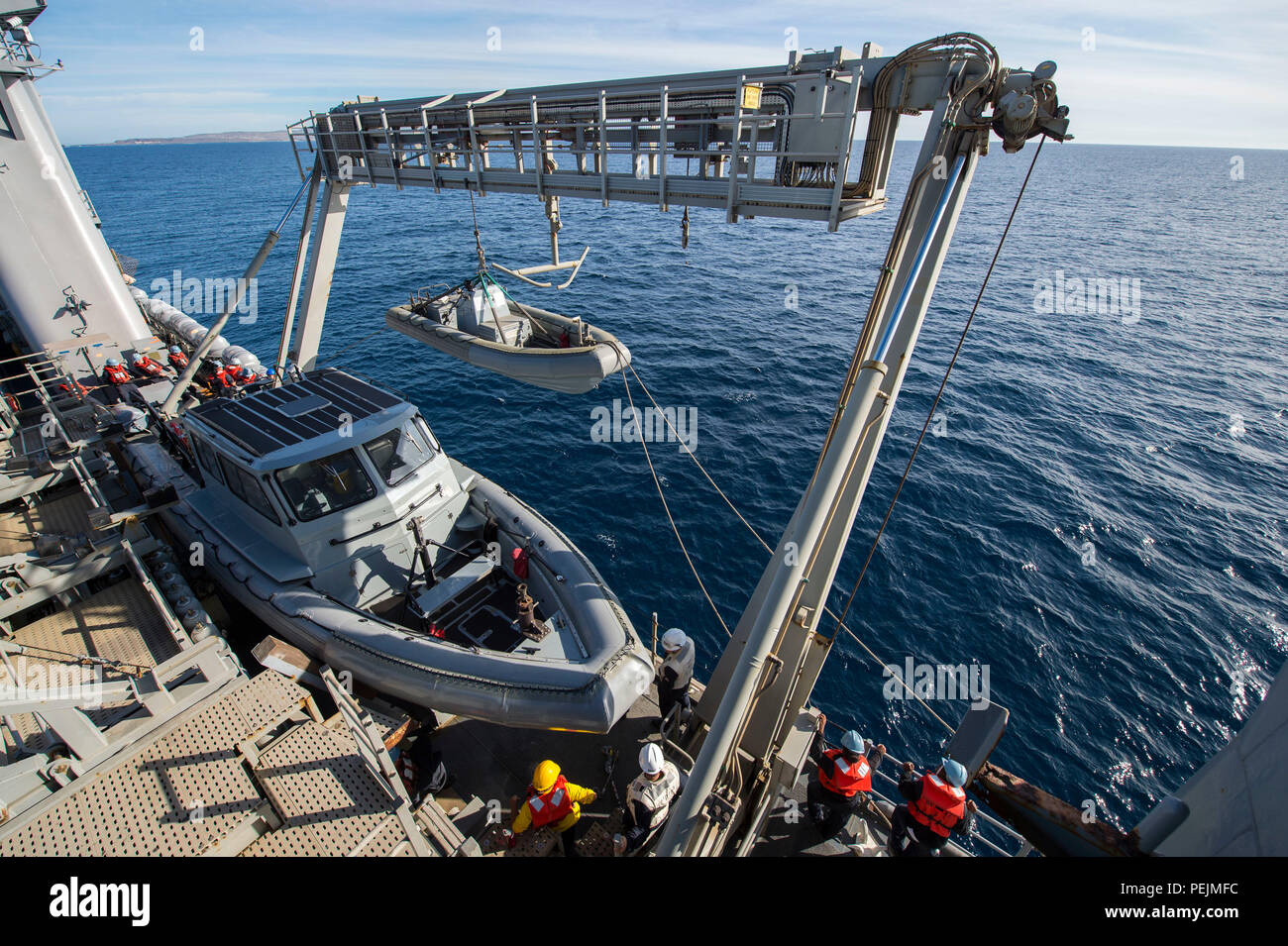 On December 6, 2015, the crew of USS Harpers Ferry (LSD 49) launches a ...