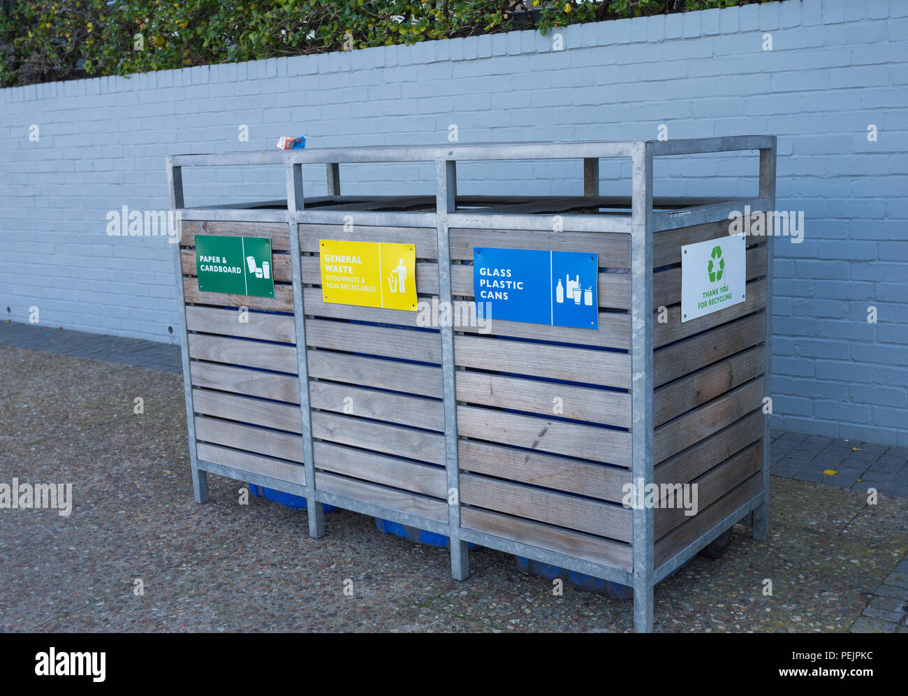 three in one recycling bins for paper, food waste and glass and cans in
