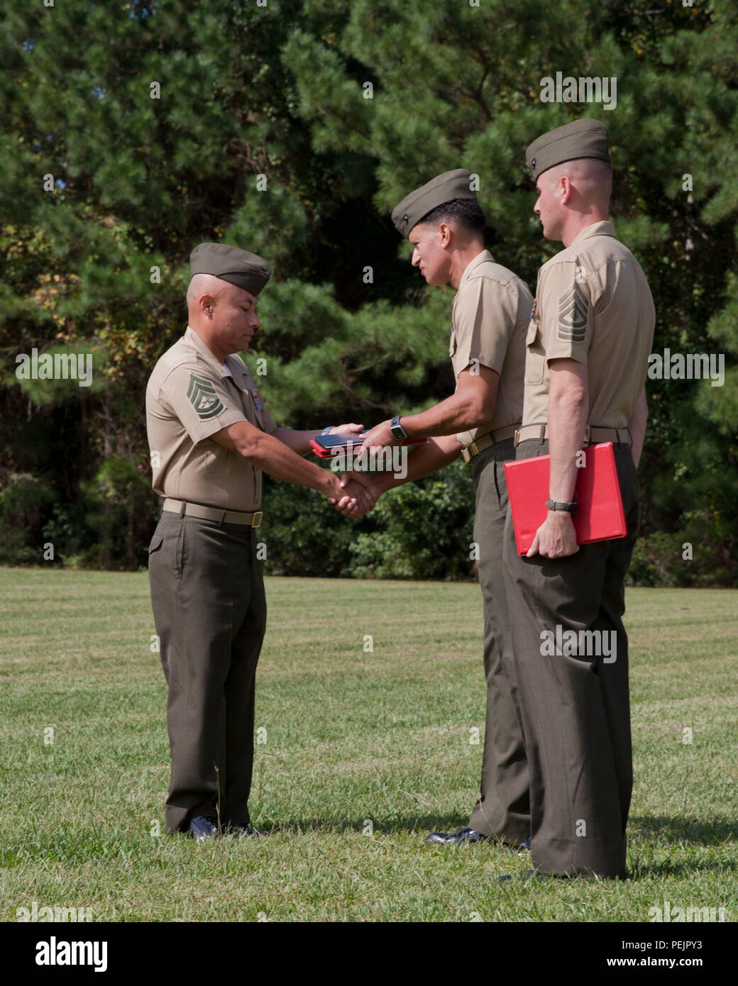 U.S. Marine Corps Colonel David E. Jones, center,commanding officer of ...