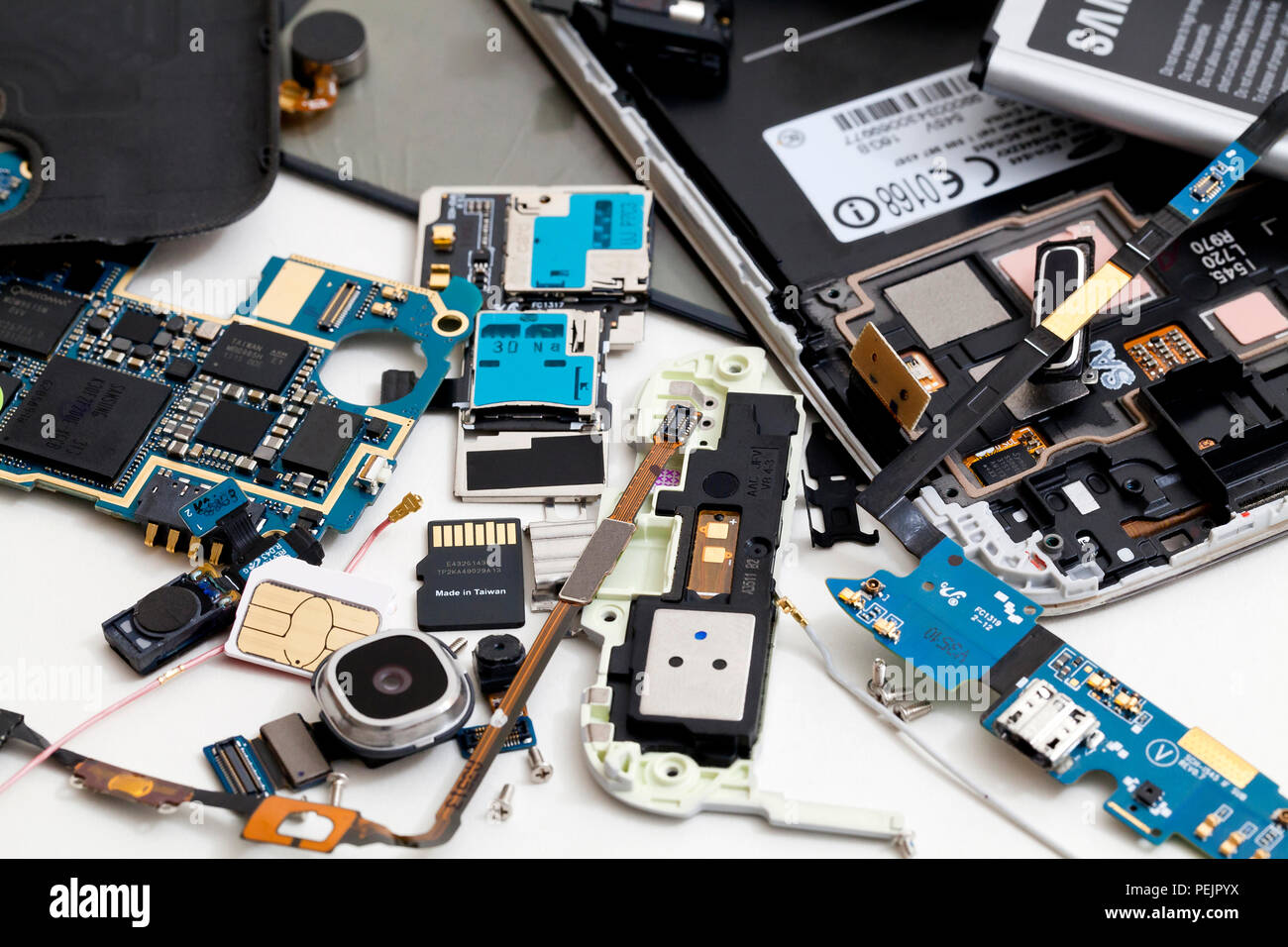 Disassembled Samsung Galaxy mobile phone, showing various internal components - USA Stock Photo