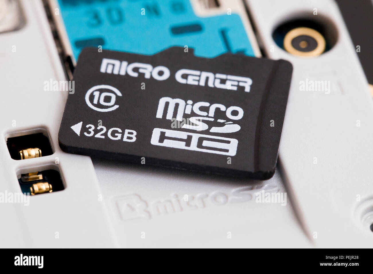 32 GB micro SD memory card removed from smart phone - USA Stock Photo