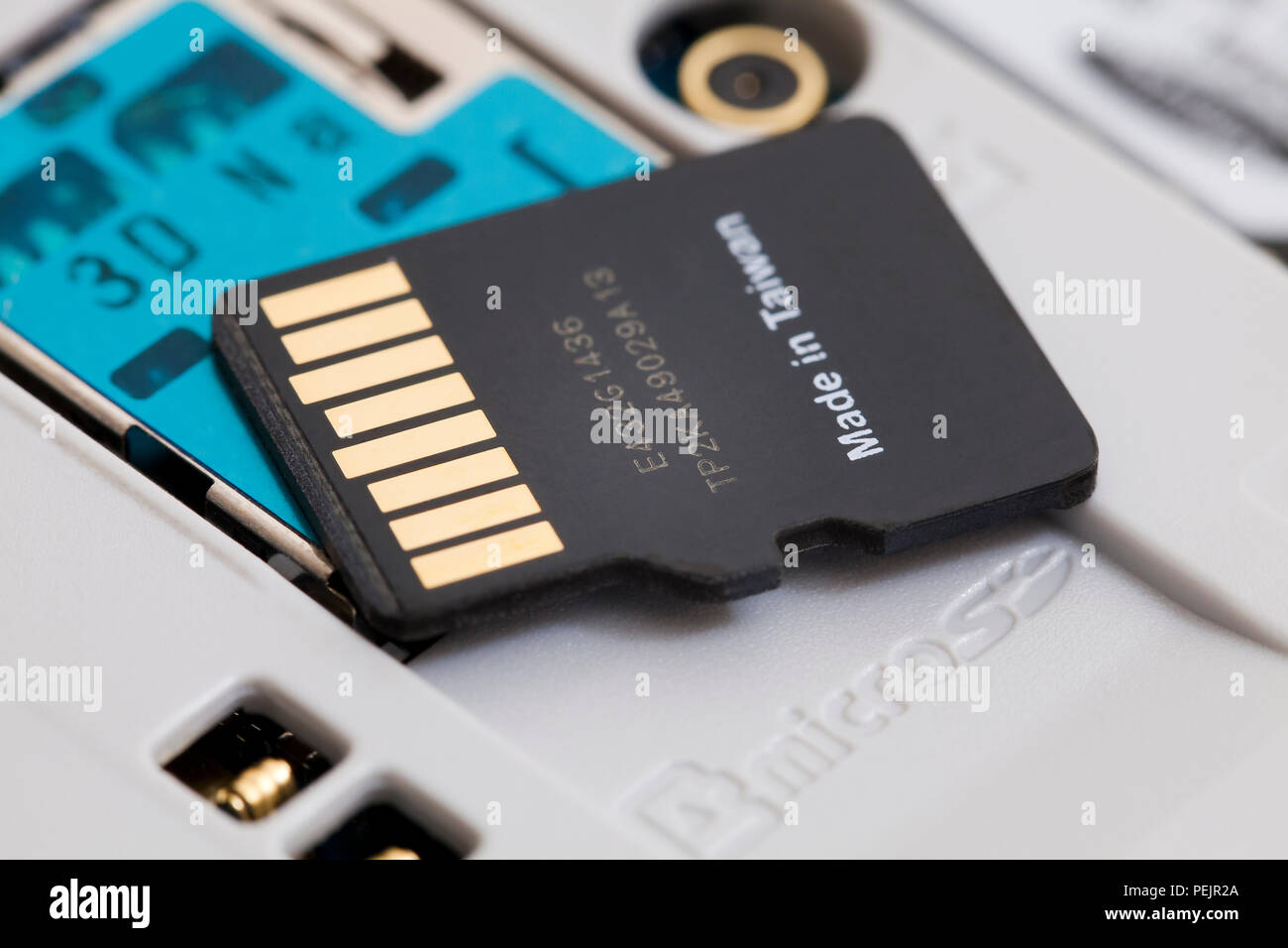 32 GB micro SD memory card removed from smart phone Stock Photo