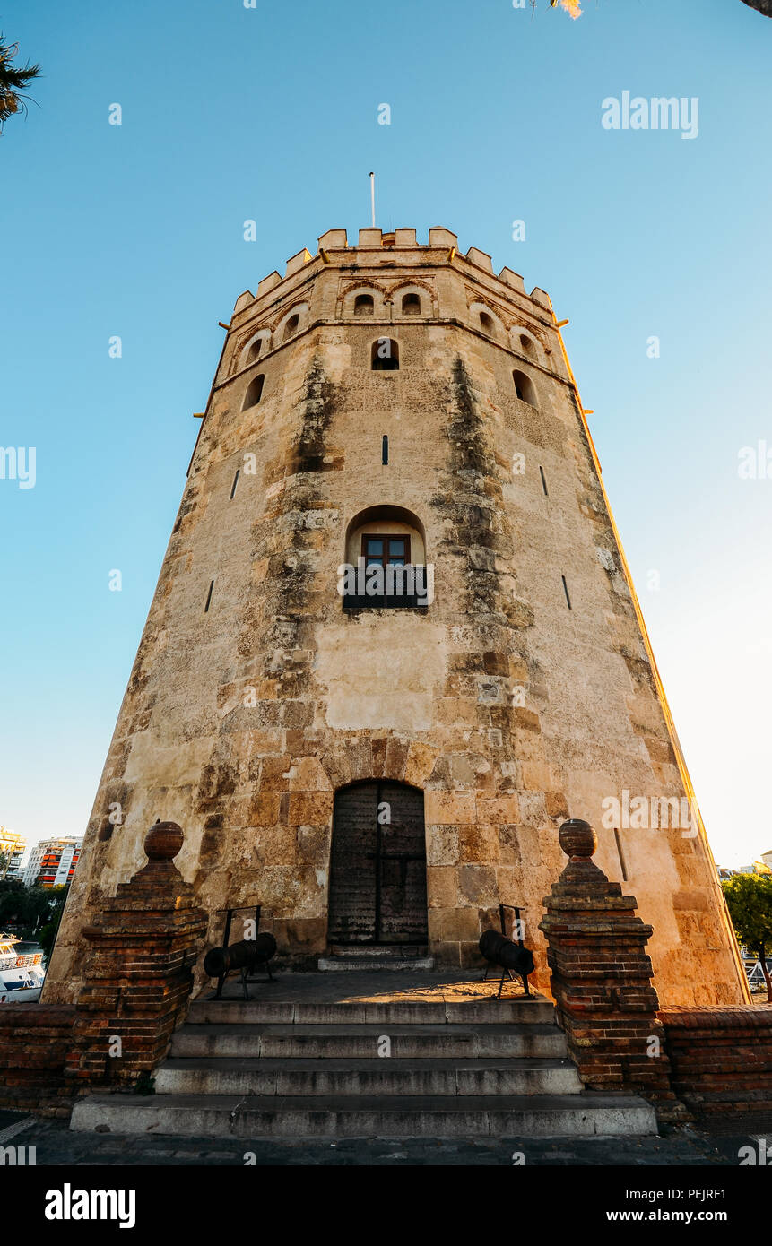 The Torre del Oro in Seville is an albarrana tower located on the left bank of the Guadalquivir River. It houses the Naval Museum of Seville. Stock Photo