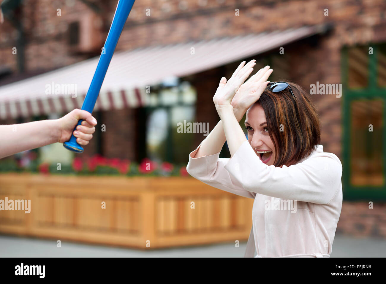 a young girl is attacked with a baseball bat Stock Photo Alamy