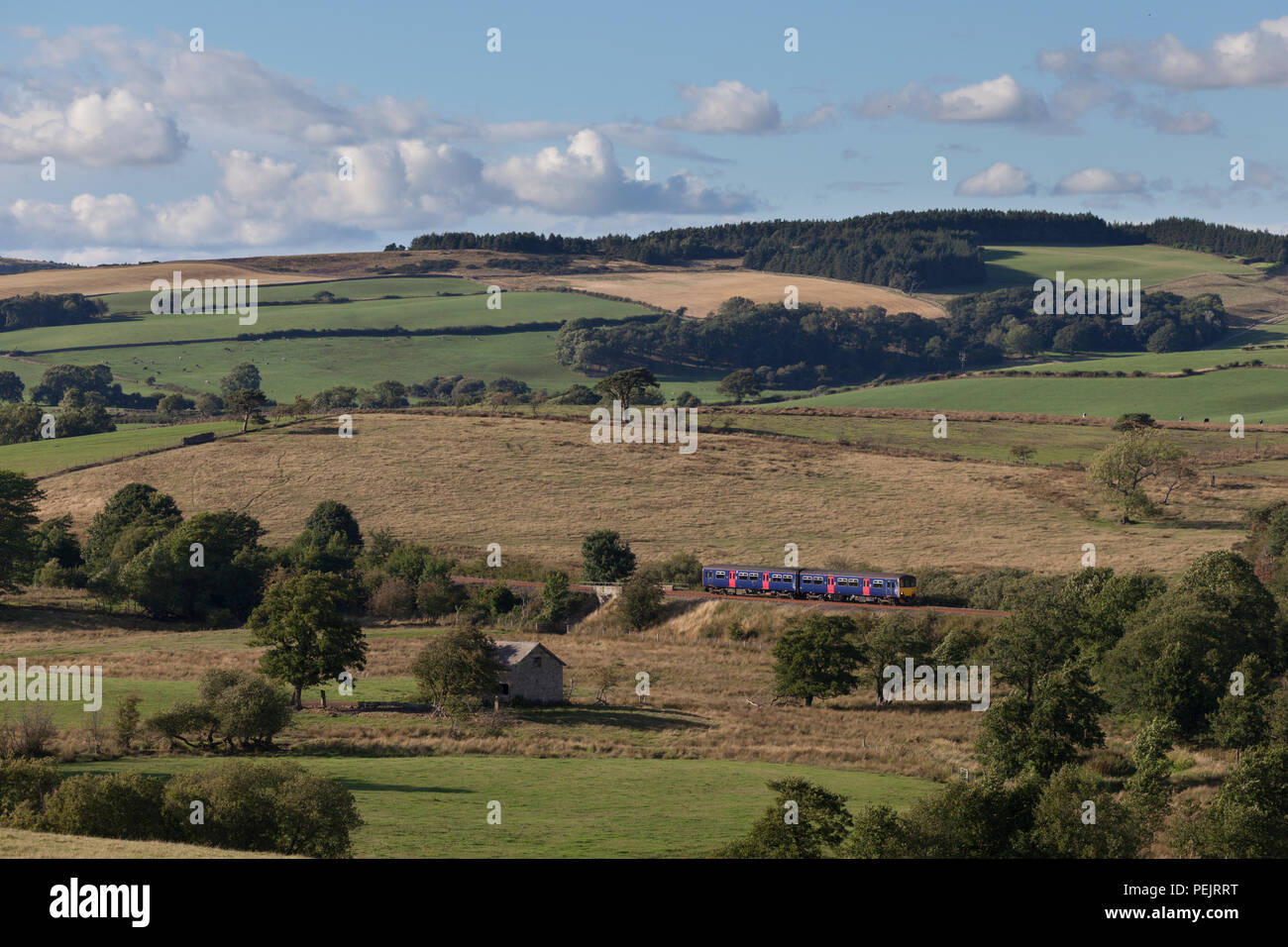 Northern Rail class 150 sprinter train (in Firstgroup colours) passing Arkholme on the Carnforth to Settle Junction little north western railway line Stock Photo