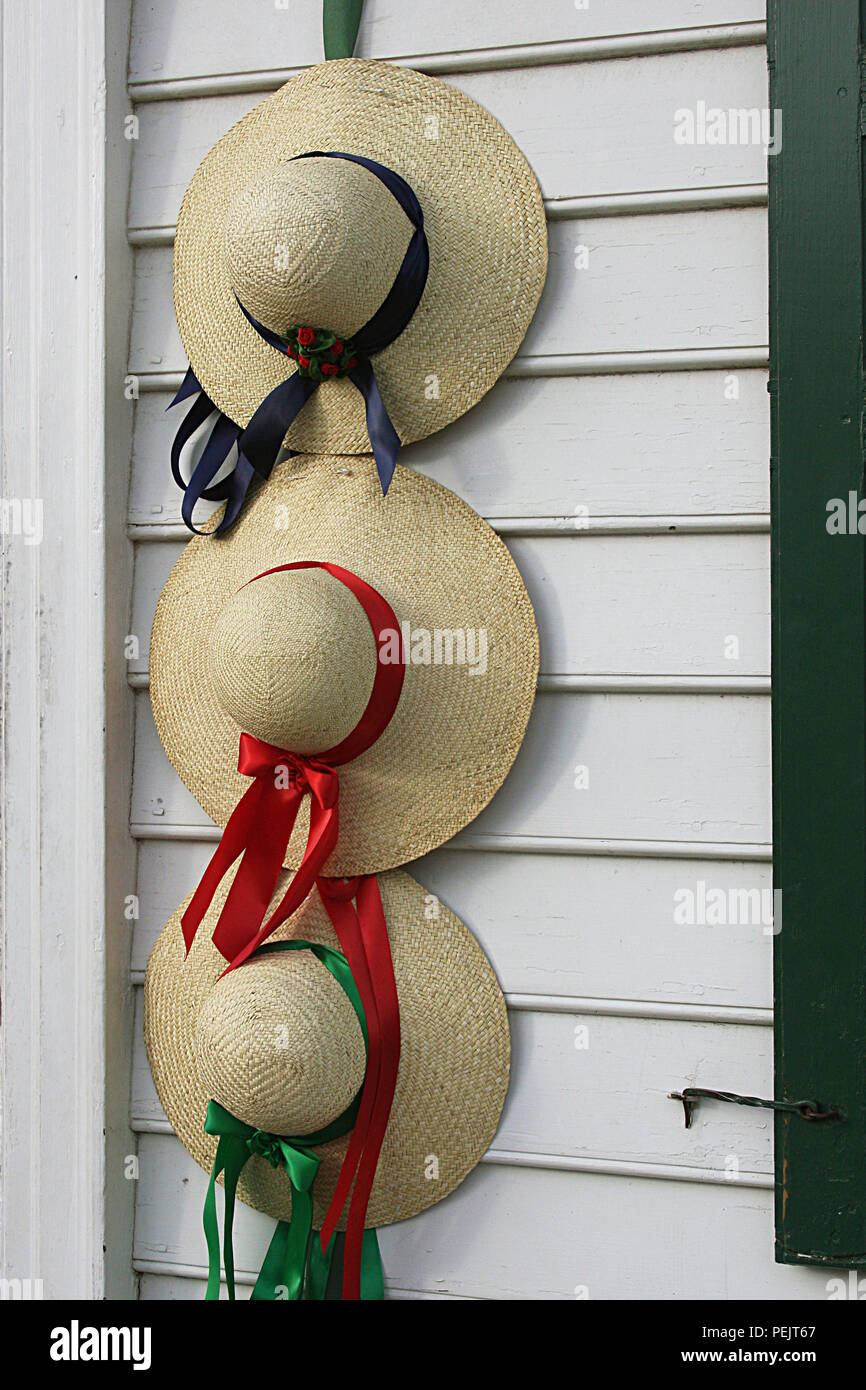 Straw hats decorating door in Colonial Williamsburg, VA, USA Stock