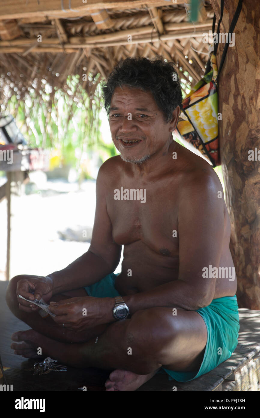 Louis Mangtau, Chief of Fais Island, talks at his house, Dec. 8, 2015, at Fais Island, Federated States of Micronesia. The Chief said, 'I was kid, my father took me to the drop zone to watch U.S. aircraft dropped the box. That was so exciting moment. I still feel same when an aircraft flies over in this season.' Operation Christmas Drop is a humanitarian/disaster relief training event where C-130 crews provide critical supplies to 56 islands throughout the Commonwealth of the Northern Marianas, Federated States of Micronesia and Republic of Palau. (U.S. Air Force photo by Osakabe Yasuo/Release Stock Photo