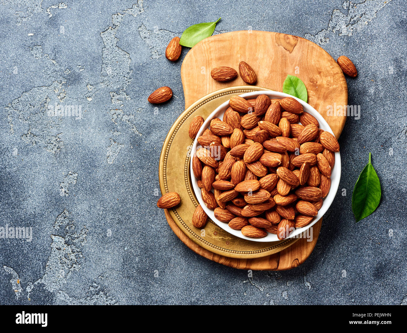 Almond nuts on gray background. Top view of roasted snacks Stock Photo ...