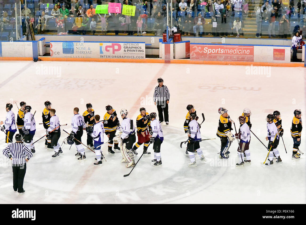 The teams meet at center ice to shake hands after the 21st Annual Army