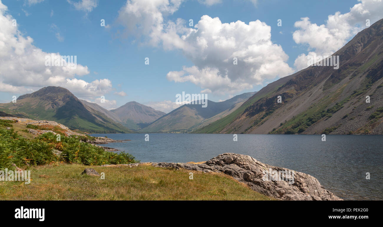 An image taken on a summers  day of a lake surrounded by mountains in the Lake District, Cumbria, England, UK Stock Photo