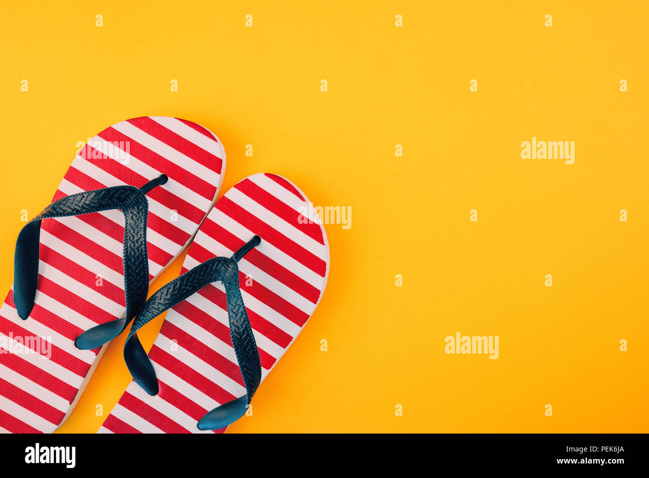 Stylish flip flop sandals with USA flag pattern, top view with copy space  over yellow background Stock Photo - Alamy