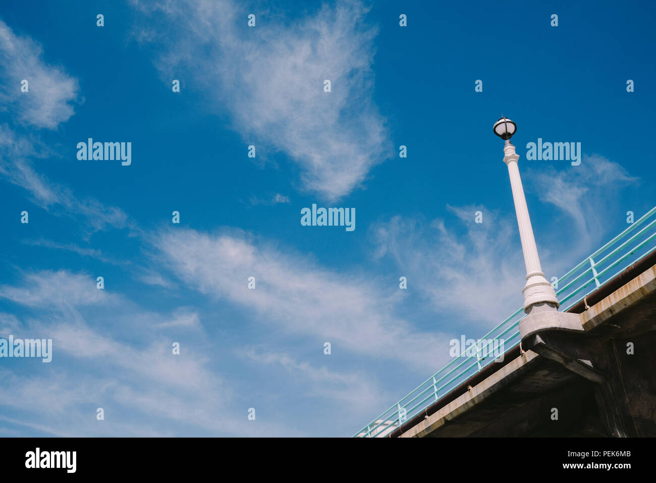 Lamp post on the pier with sky Stock Photo