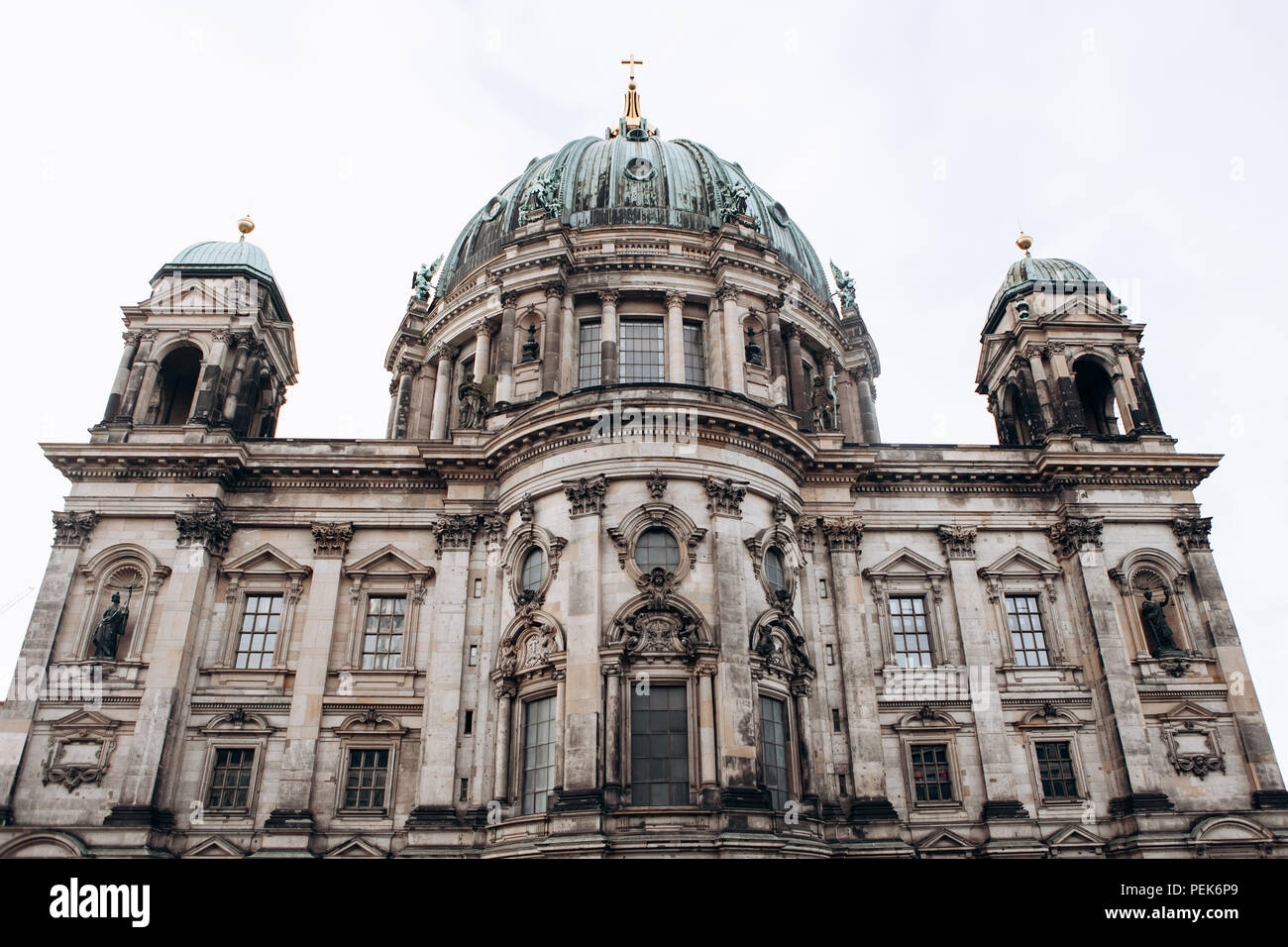 Beautiful old building in the style of neoclassicism and baroque with cross and sculptures Stock Photo