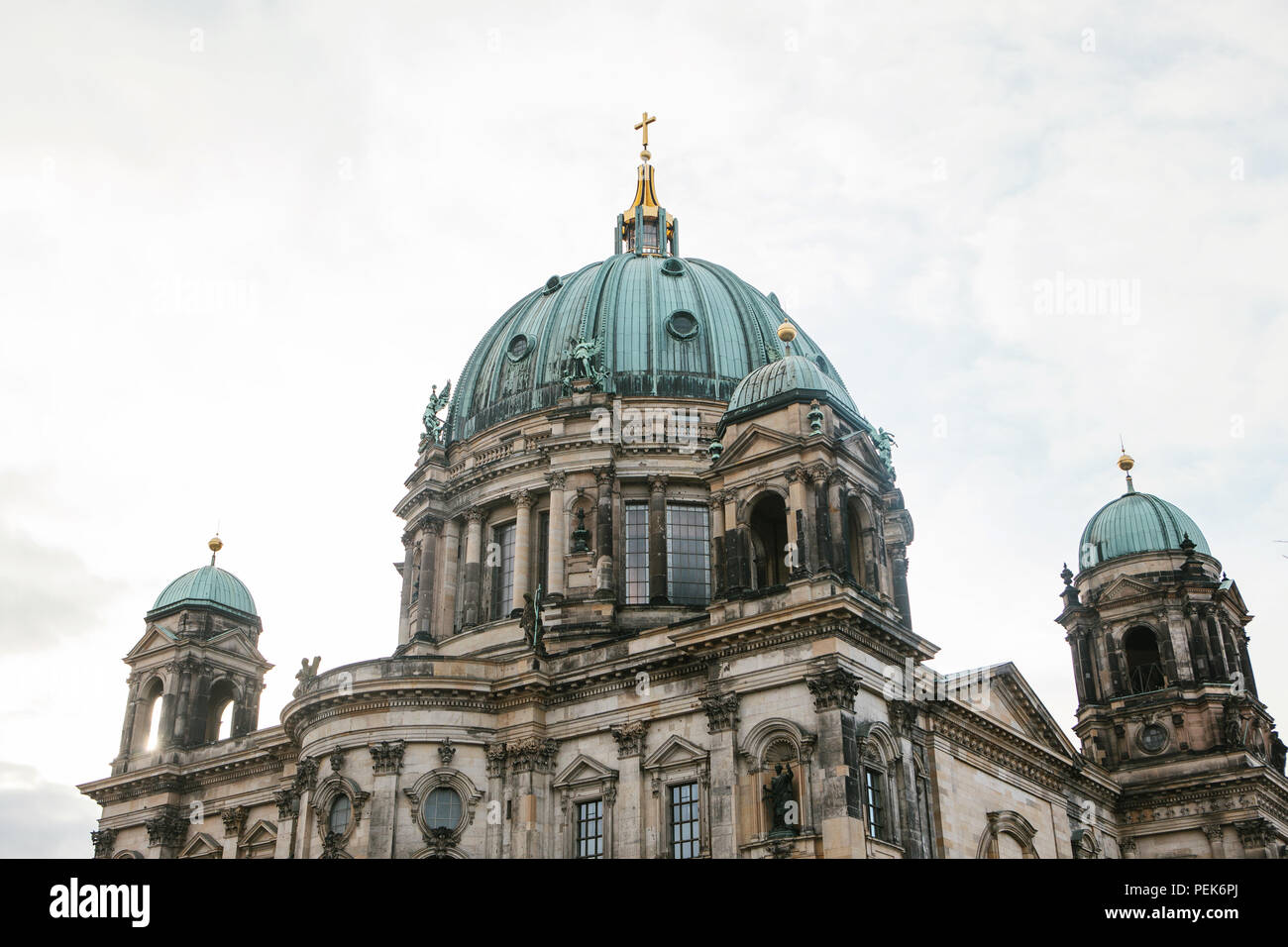 Beautiful old building in the style of neoclassicism and baroque with cross and sculptures Stock Photo