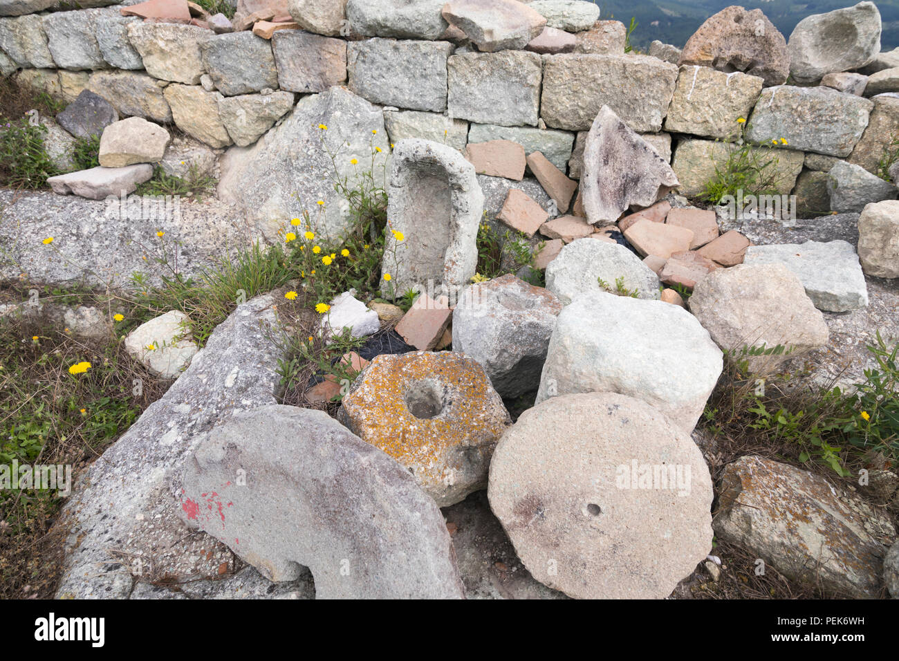 Ancient millstones at excavation Perperikon with remnants of ancient Thracian and Greek culture in Bulgaria Stock Photo