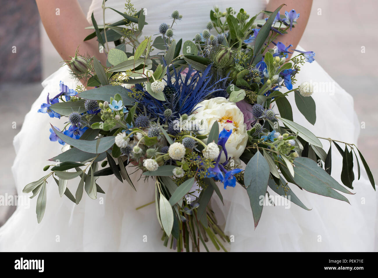 the Wedding bouquet of dried flowers, eucalyptus, peony, dahlias and dolphinium Stock Photo