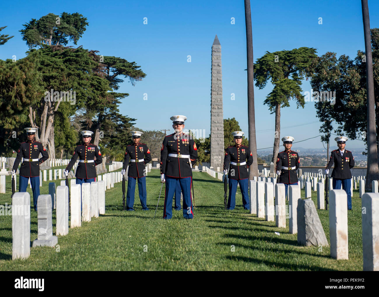 151212-N-QW941-005  SAN DIEGO (Dec. 12, 2015) Marines stand in formation during the Wreaths Across America ceremony at Fort Rosecran’s National Cemetery. Wreaths Across America is an annual event that takes place in multiple locations where volunteers lay wreaths on tombstones of fallen military members. (U.S. Navy photo by Mass Communication Specialist 3rd Class Trevor Kohlrus/Released) Stock Photo