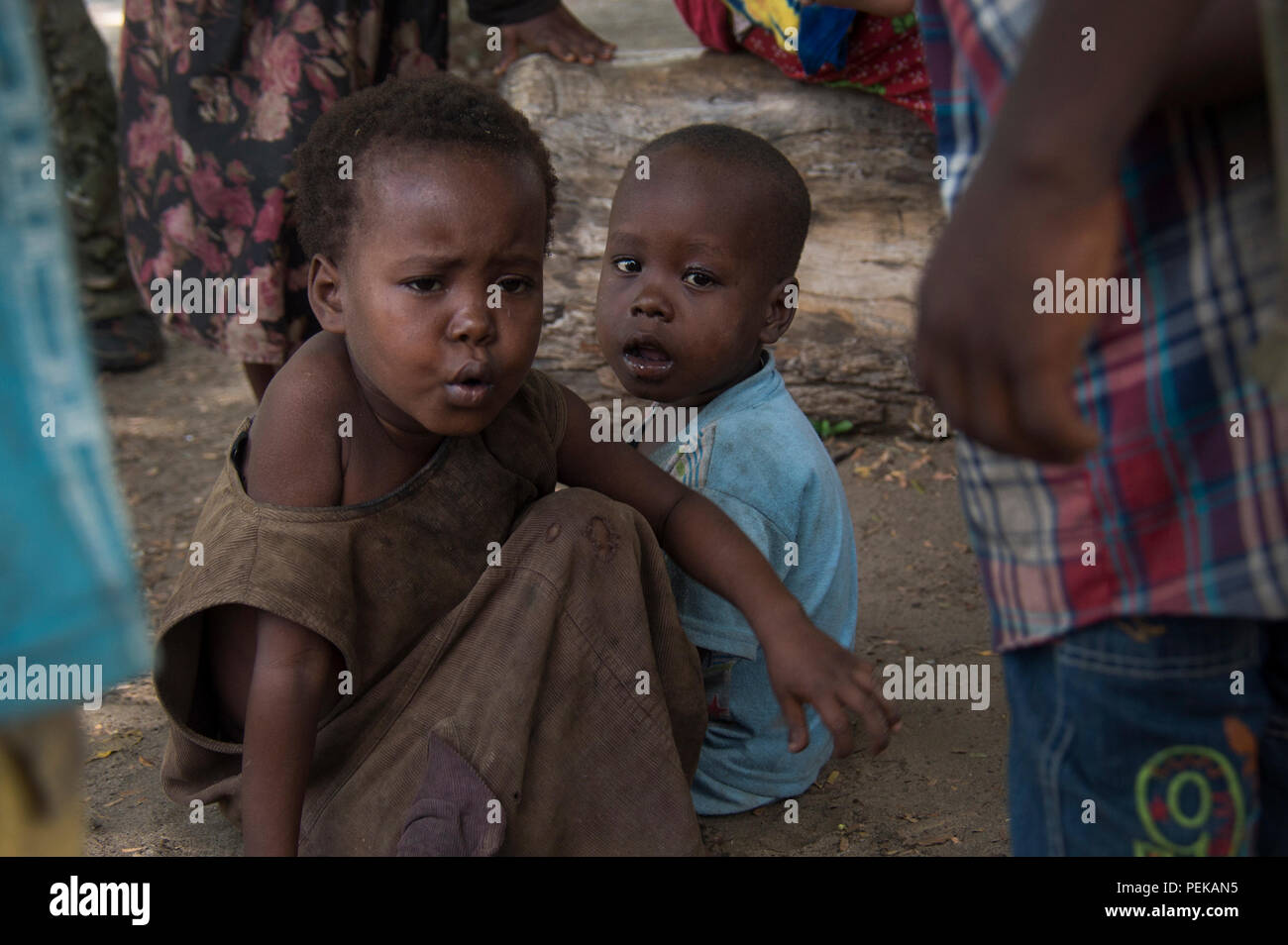 (KIANGWE, Kenya) Children wait to be seen by medical personnel from Safari Doctors during a medical seminar (MEDSEM) in Kiangwe, Kenya, on Dec. 6, 2015. Special Operations Command Forward – East Africa, Team Manda Bay is conducting the MEDSEM along with the Lamu County Ministry of Health and Safari Doctors to provide medical services to remote villages in the area and engage with village leaders to address their concerns. (U.S. Navy photo by Mass Communication Specialist 1st Class Tony DeFilippo/Released) Stock Photo