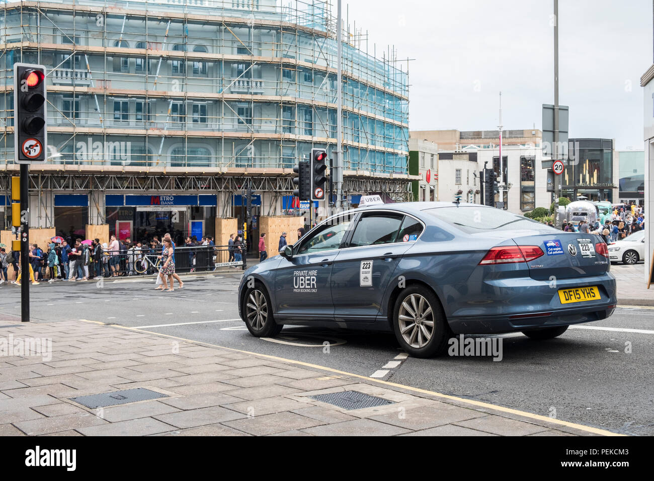 Uber taxi cab minicab on a UK street. Stock Photo