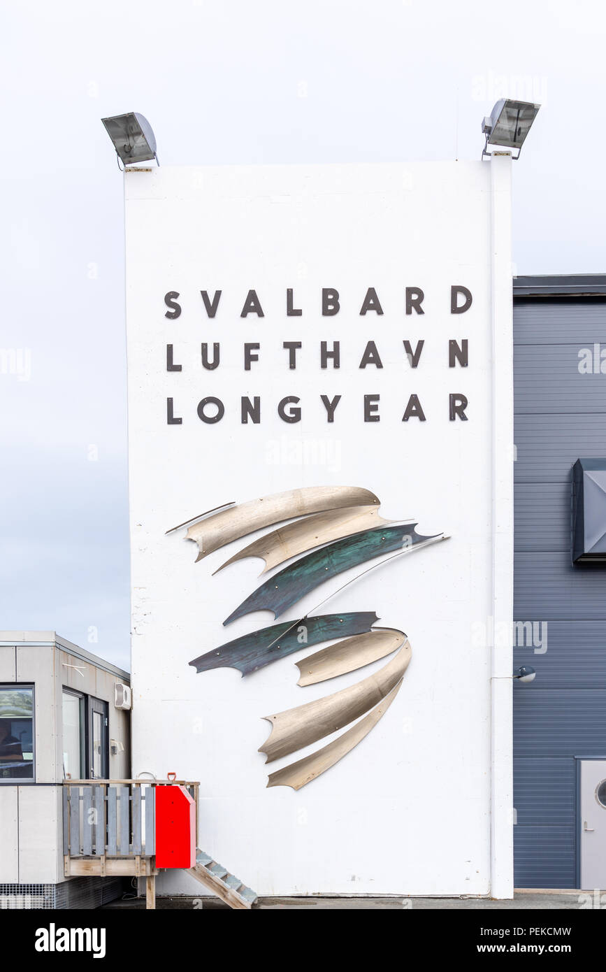 Airport terminal building and sign (Svalbard Lufthavn Longyear) in Longyearbyen, Svalbard, Norway. Stock Photo