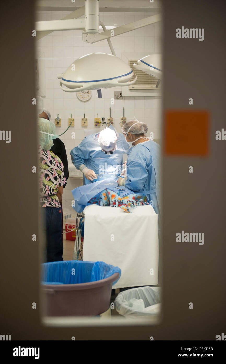Medical Team Performing Surgical Operation in Bright Modern Operating ...
