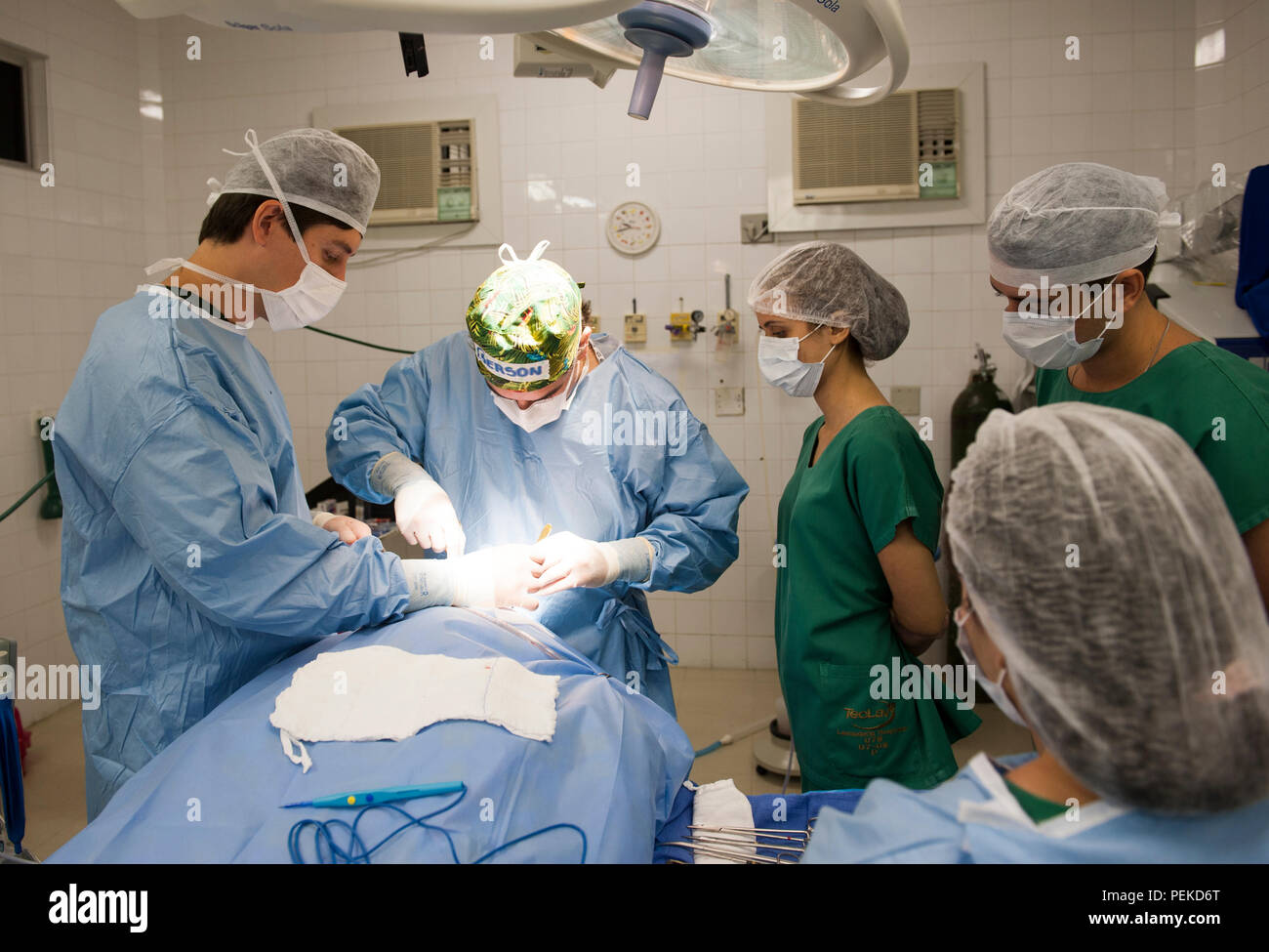 Medical Team Performing Surgical Operation in Bright Modern Operating ...