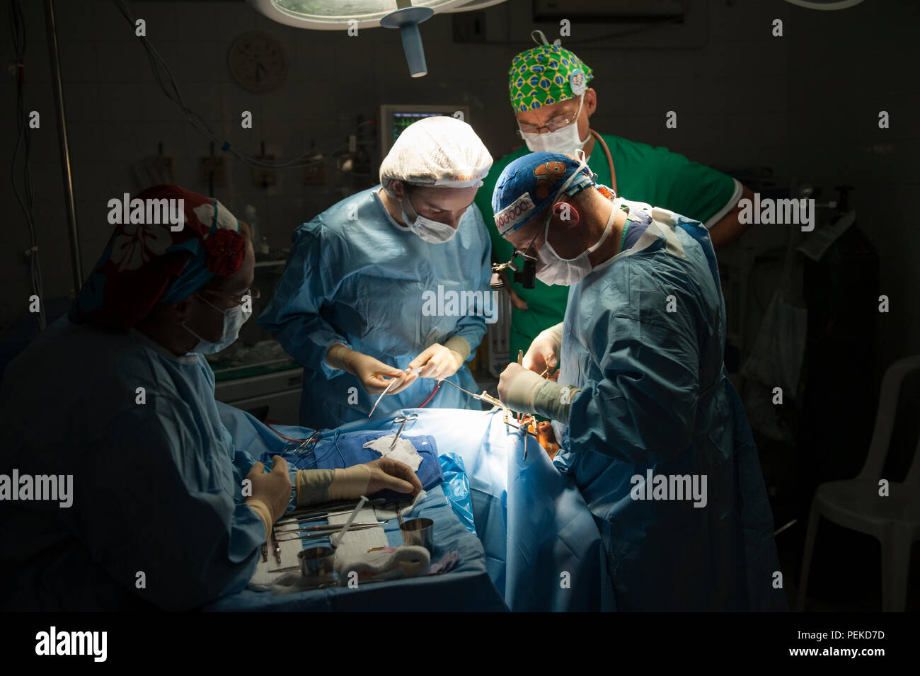 Medical Team Performing Surgical Operation in Bright Modern Operating ...