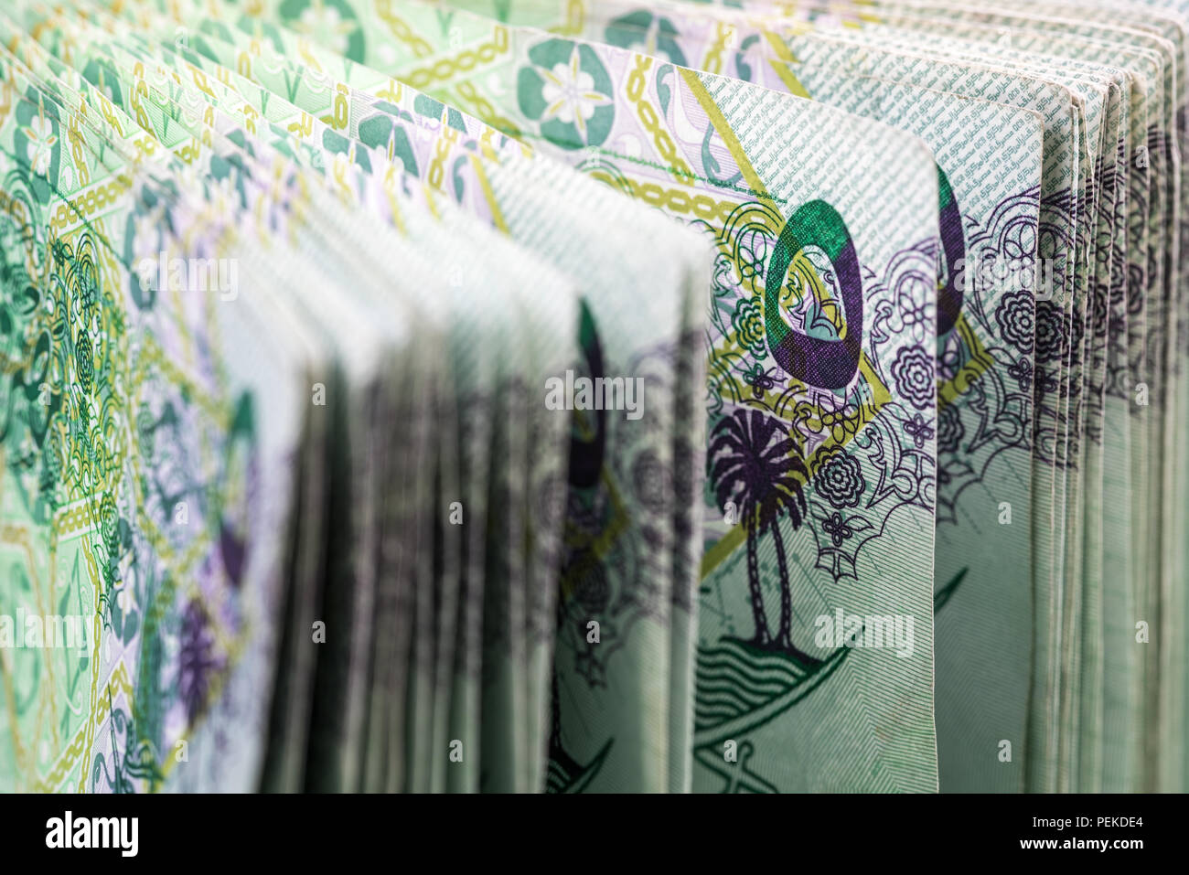 Close up of 5 Qatari Riyal bank note with selective focus. Stock Photo