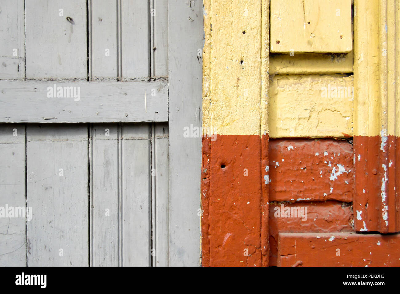 Old wall in orange, yellow and grey Stock Photo