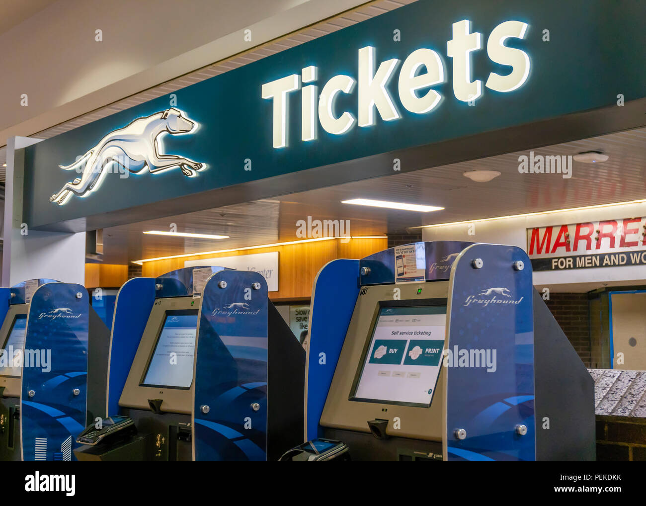 Greyhound ticket machine inside a terminal Stock Photo