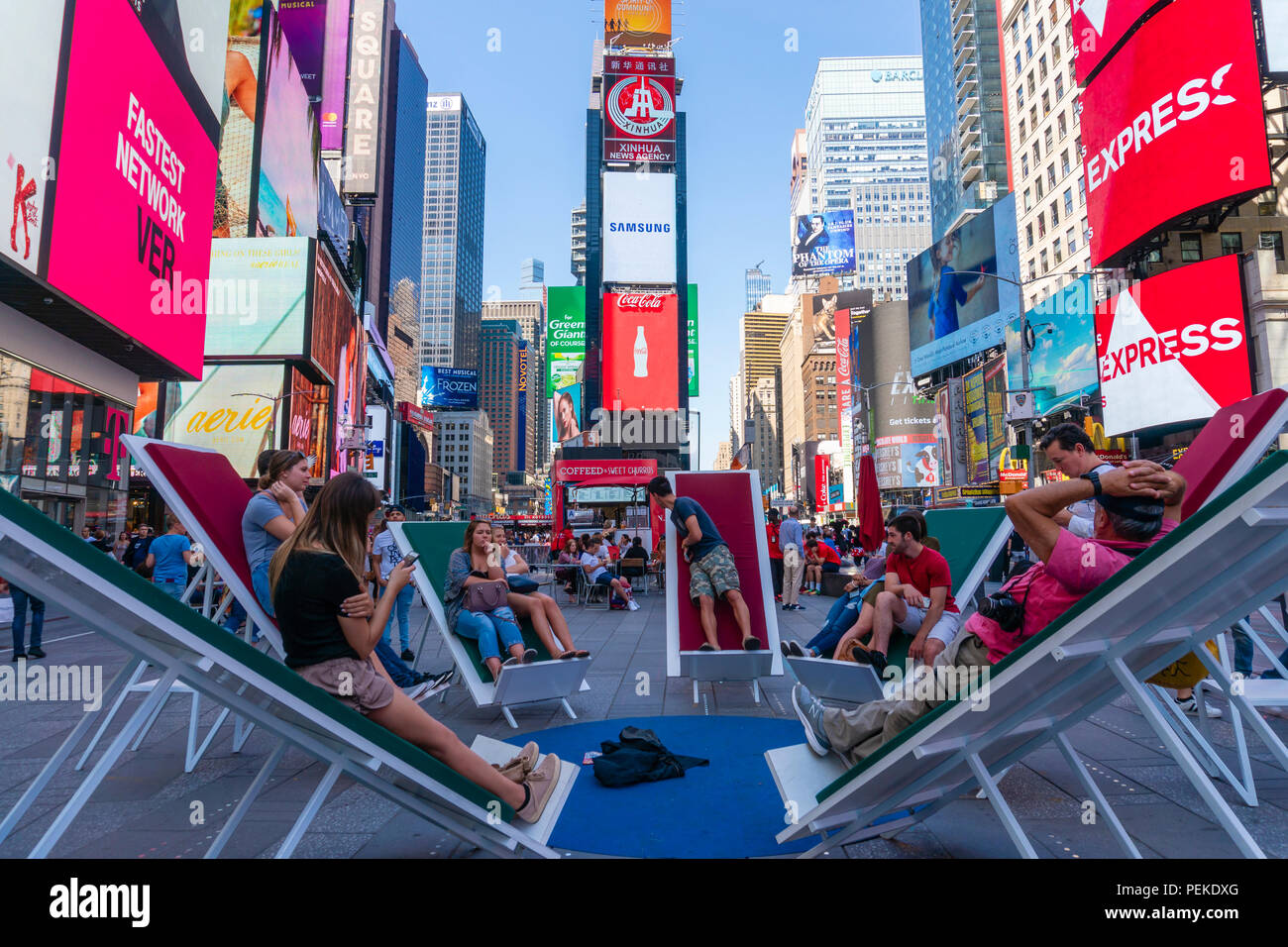 People relaxing at Times Square in New York City Stock Photo