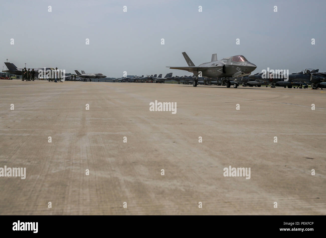 Marines observe a Marine Fighter Attack Squadron (VMFA) 122 F-35 Lightning II preparing to taxi during Exercise Northern Lightning at Volk Field Counterland Training Center, Camp Douglas, Wis. Aug. 14. Exercise Northern Lightning 2018 allows the Air Force, Marine Corps and Navy to strengthen interoperability between services and gives the different branches a greater understanding of aviation capabilities within a joint fighting force. (U.S. Marine Corps photo by Sgt. David Bickel) Stock Photo