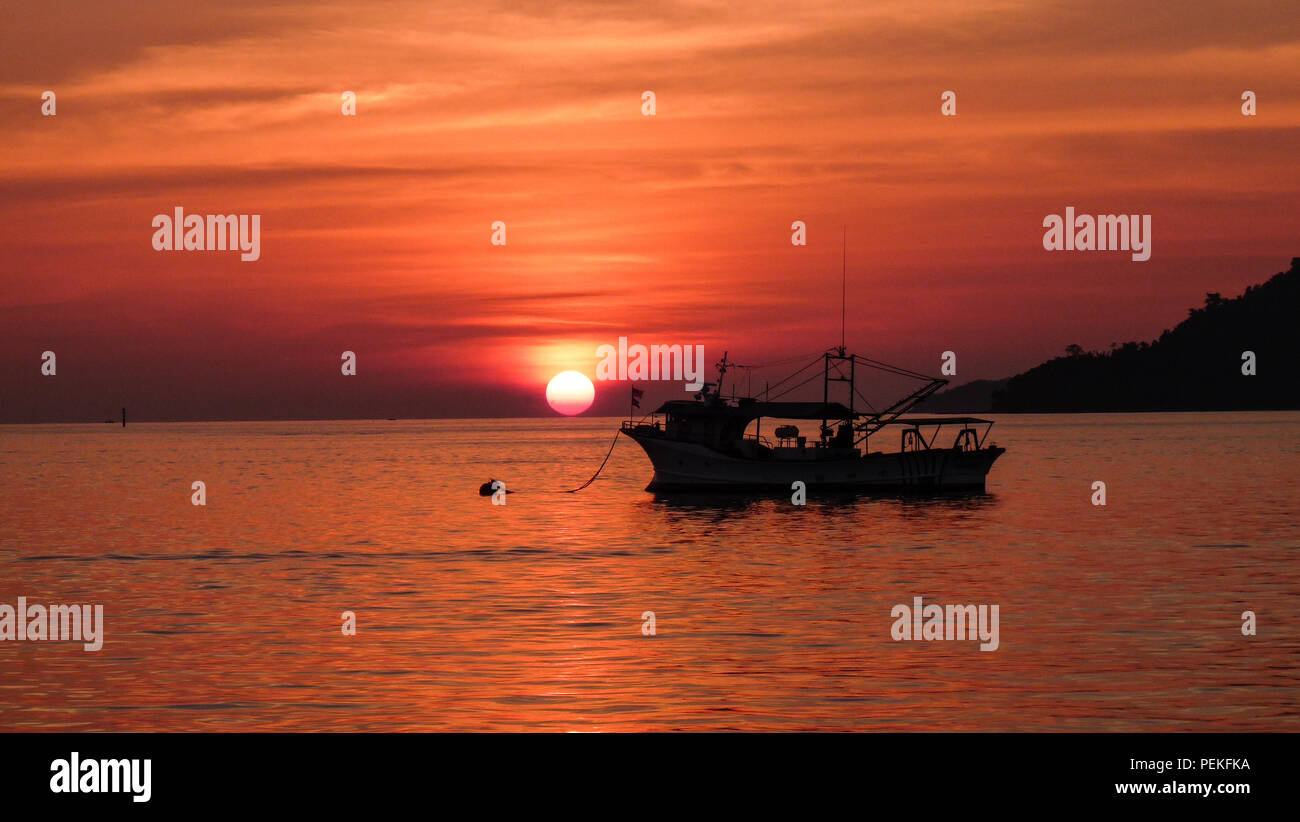 Sunset over boat on sea hi-res stock photography and images - Alamy