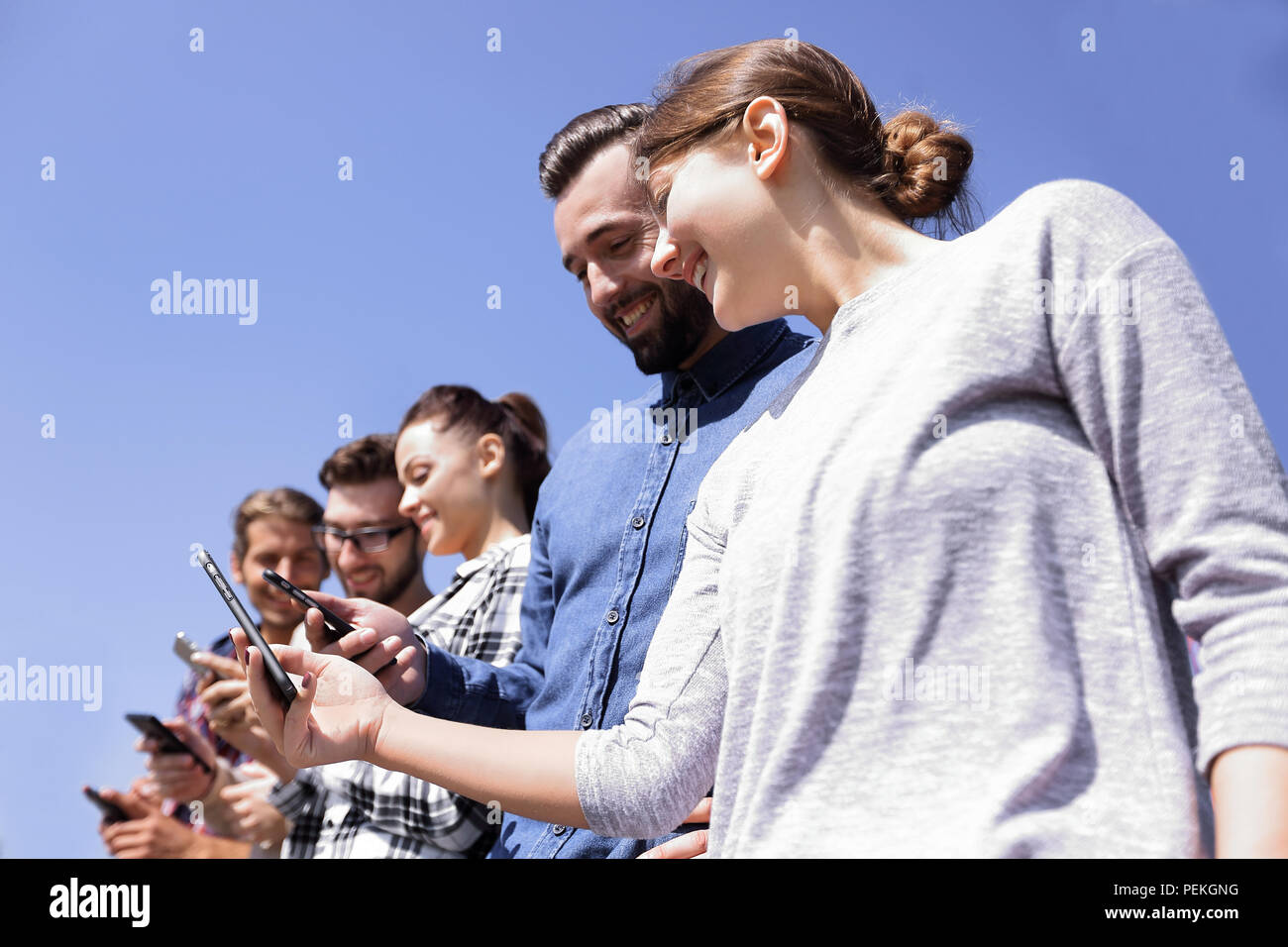 group of young people with modern gadgets Stock Photo