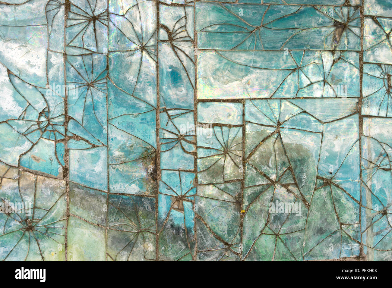 Patterns of broken glass tile on the wall Stock Photo