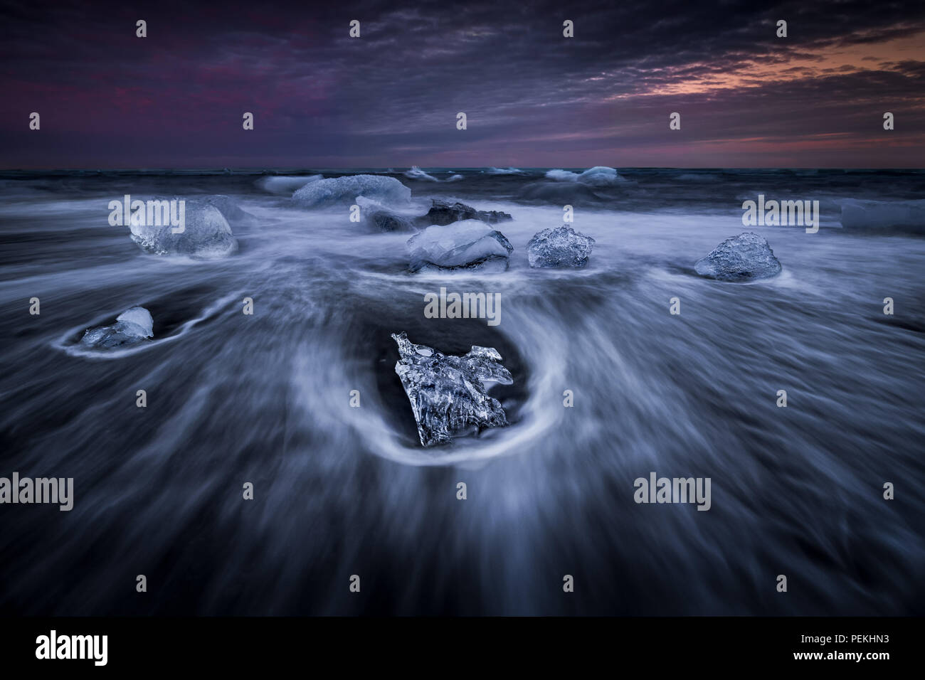 Glacial Ice washed ashore on the beach at Jokulsarlon Black Sand Beach also known as Breidamerkursandur, Iceland Stock Photo