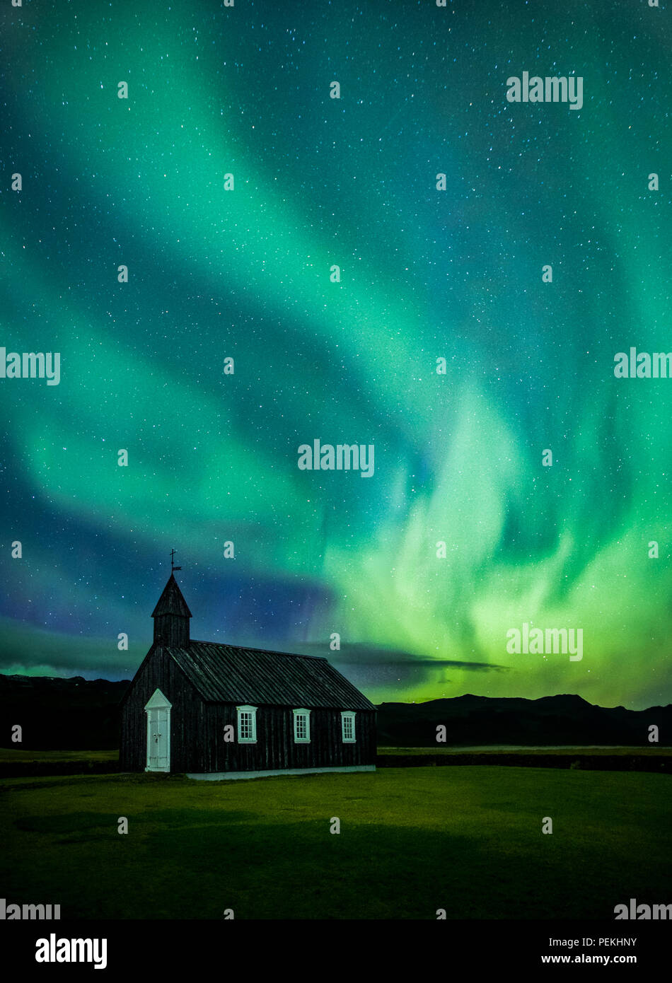 Budir Church Under the Aurora Borealis and Northern Lights On the Snaefellsnes Peninsula, Iceland Stock Photo