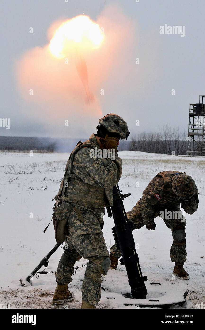 A 120 Mm Mortar Round Exits The Tube In A Flash Of Smoke And Fire