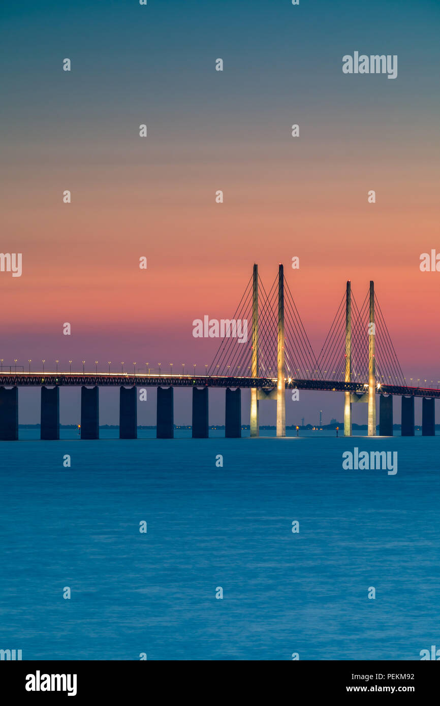 The Oresund Bridge is the longest combined road and rail bridge in Europe and connects two major cities: Copenhagen and Malmo. Stock Photo